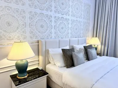 Łóżko lub łóżka w pokoju w obiekcie MONDRIAN Suites & Apartments Royal Route Old Town