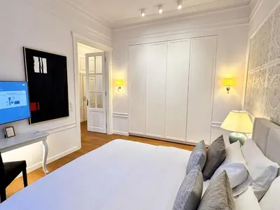 Łóżko lub łóżka w pokoju w obiekcie MONDRIAN Suites & Apartments Royal Route Old Town