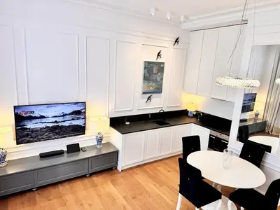 Telewizja i/lub zestaw kina domowego w obiekcie MONDRIAN Suites & Apartments Royal Route Old Town