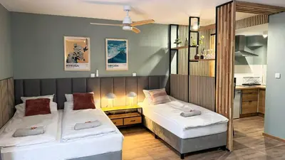 Łóżko lub łóżka w pokoju w obiekcie Green Studio with balcony - free parking