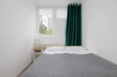 Łóżko lub łóżka w pokoju w obiekcie Bright Apartament Warsaw Wola Ideal for Remote Work by Noclegi Renters