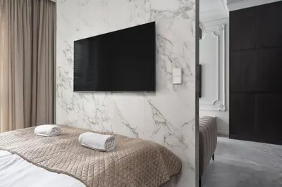 Łóżko lub łóżka w pokoju w obiekcie Chronos - Warszawa Wola by Downtown Apartments