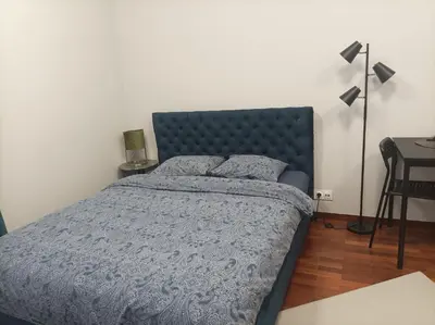 Łóżko lub łóżka w pokoju w obiekcie Solidarnosci155GuestRooms
