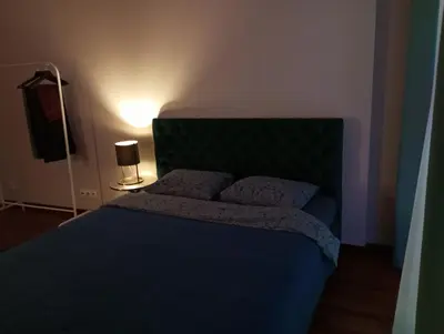 Łóżko lub łóżka w pokoju w obiekcie Solidarnosci155GuestRooms