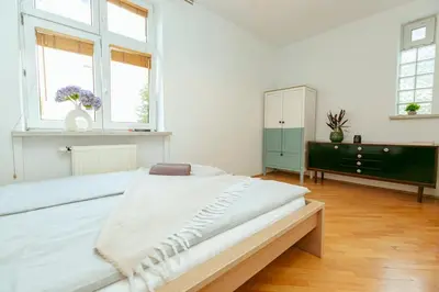 Łóżko lub łóżka w pokoju w obiekcie Ząbkowska Klimat Starej Pragi