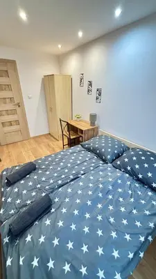 Łóżko lub łóżka w pokoju w obiekcie Rooms in Warsaw - K3
