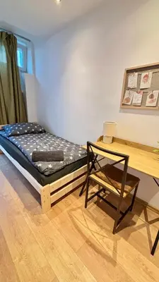 Łóżko lub łóżka w pokoju w obiekcie Rooms in Warsaw - K3