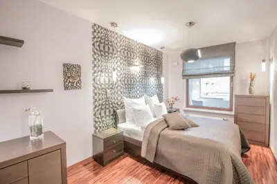 Łóżko lub łóżka w pokoju w obiekcie Exclusive Apartments Warsaw City Centre