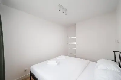 Łóżko lub łóżka w pokoju w obiekcie Elbląska Modern Apartment by BookingHost