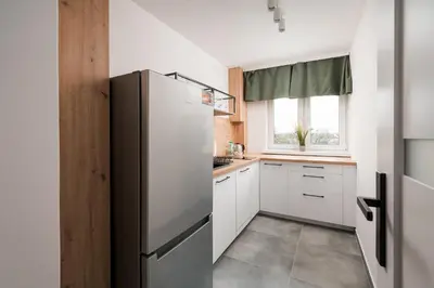 Kuchnia lub aneks kuchenny w obiekcie Elbląska Modern Apartment by BookingHost