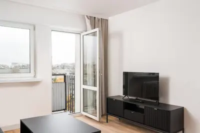 Telewizja i/lub zestaw kina domowego w obiekcie Elbląska Modern Apartment by BookingHost