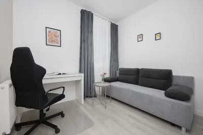 Część wypoczynkowa w obiekcie Family Apartment Cybernetyki with AC and Parking by Noclegi Renters