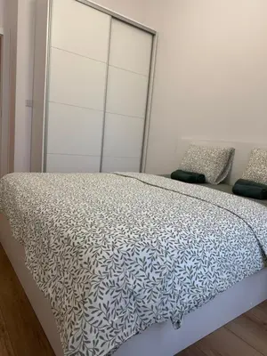 Łóżko lub łóżka w pokoju w obiekcie MaxApart Apartament Wiktoryn