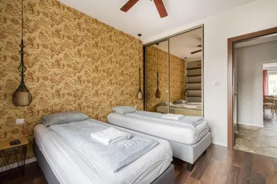 Łóżko lub łóżka w pokoju w obiekcie Labo Apartment Dzielna