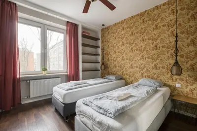 Łóżko lub łóżka w pokoju w obiekcie Labo Apartment Dzielna