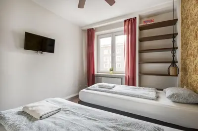 Łóżko lub łóżka w pokoju w obiekcie Labo Apartment Dzielna