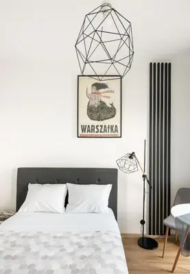 Łóżko lub łóżka w pokoju w obiekcie Wola Expo City View Central Apartment by BookingHost