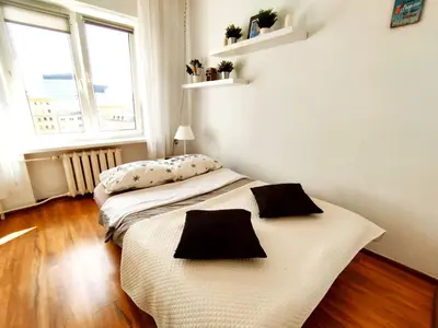 Łóżko lub łóżka w pokoju w obiekcie Cozy Studio at Plac Konstytucji