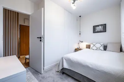 Łóżko lub łóżka w pokoju w obiekcie Luksusowy apartament blisko centrum, parking w garażu podziemnym