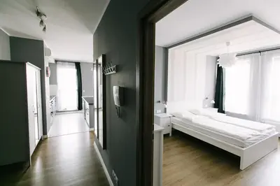 Łóżko lub łóżka w pokoju w obiekcie RENTTNER Apartamenty
