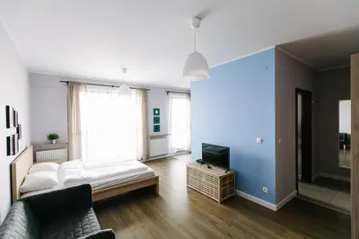 Łóżko lub łóżka w pokoju w obiekcie RENTTNER Apartamenty