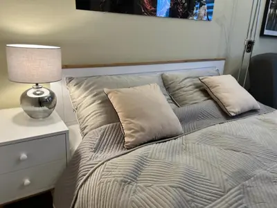 Łóżko lub łóżka w pokoju w obiekcie OhMyHome-Plac Zawiszy