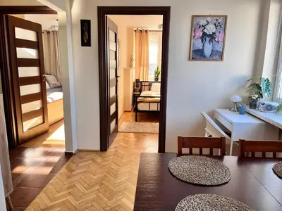 Łóżko lub łóżka w pokoju w obiekcie OhMyHome-Plac Zawiszy