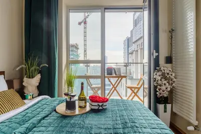 Łóżko lub łóżka w pokoju w obiekcie Lumina cozy apartment Platinum Tower