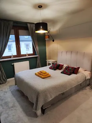 Łóżko lub łóżka w pokoju w obiekcie Stylowy apartament przy rezerwacie