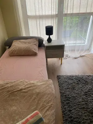 Łóżko lub łóżka w pokoju w obiekcie Monika House