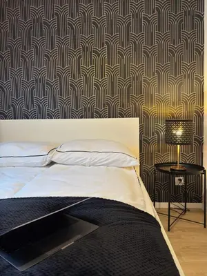 Łóżko lub łóżka w pokoju w obiekcie Nowolipie 16, City Center Apartment