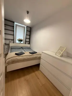 Łóżko lub łóżka w pokoju w obiekcie Saska Kępa Apartament LUX