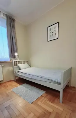 Łóżko lub łóżka w pokoju w obiekcie Apartament Metro Natolin