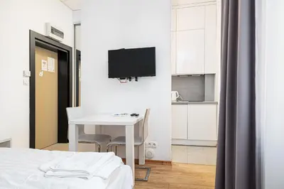 Telewizja i/lub zestaw kina domowego w obiekcie RentPlanet - Studio Aleje Jerozolimskie