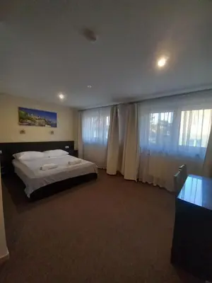 Łóżko lub łóżka w pokoju w obiekcie Valda House