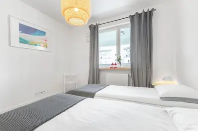 Łóżko lub łóżka w pokoju w obiekcie Apartament Zwierz