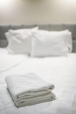 Łóżko lub łóżka w pokoju w obiekcie Polmedica Nowoogrodzka A