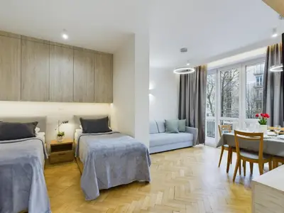Łóżko lub łóżka w pokoju w obiekcie Cosy Studio in the Capital by Noclegi Renters