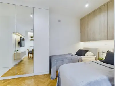 Łóżko lub łóżka w pokoju w obiekcie Cosy Studio in the Capital by Noclegi Renters