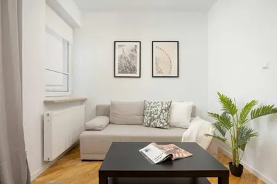 Część wypoczynkowa w obiekcie Stylowy Apartament dla 6 Osób z Parkingiem by Noclegi Renters