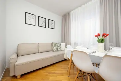 Część wypoczynkowa w obiekcie Stylowy Apartament dla 6 Osób z Parkingiem by Noclegi Renters