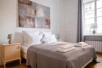 Łóżko lub łóżka w pokoju w obiekcie Ego Apartments Old Town