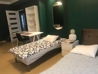 Łóżko lub łóżka w pokoju w obiekcie Noclegi Willa Saska