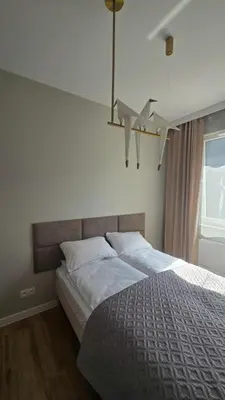 Łóżko lub łóżka w pokoju w obiekcie Warsaw Praga Apartment 2
