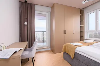 Łóżko lub łóżka w pokoju w obiekcie ShortStayPoland Śródziemnomorska B145