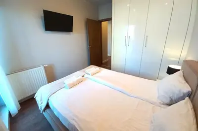 Łóżko lub łóżka w pokoju w obiekcie erApartments Oxygen Residence