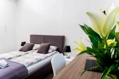 Łóżko lub łóżka w pokoju w obiekcie erApartments Oxygen Residence
