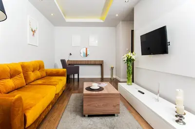 Telewizja i/lub zestaw kina domowego w obiekcie erApartments Oxygen Residence