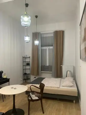 Łóżko lub łóżka w pokoju w obiekcie Apartament w Centrum Warszawy