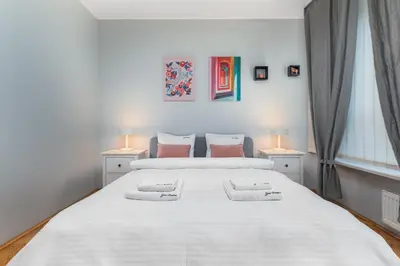 Łóżko lub łóżka w pokoju w obiekcie Apartament Inflancka by Your Freedom